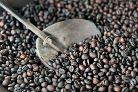 roasting coffe with wood ladle の写真素材