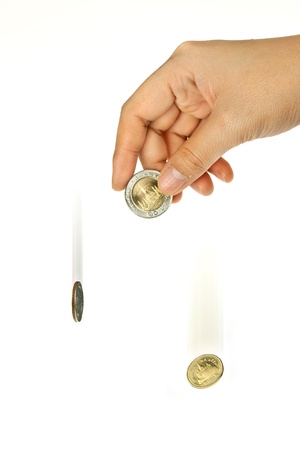 falling coin in isolated backgroundの写真素材