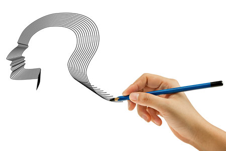 Drawing head with pencil in woman hand の写真素材