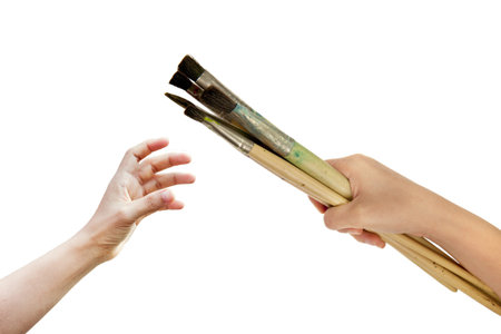 hand holding many  paint brush