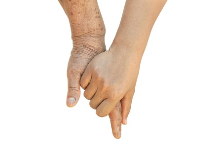Old and Young Women Holding Handの写真素材