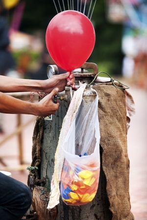 hand  Compressing gas to balloonの写真素材