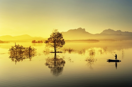 fisherman fishing in big lakeの写真素材