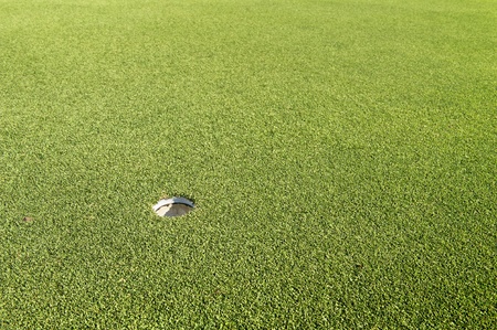 hole on green in golf courseの写真素材