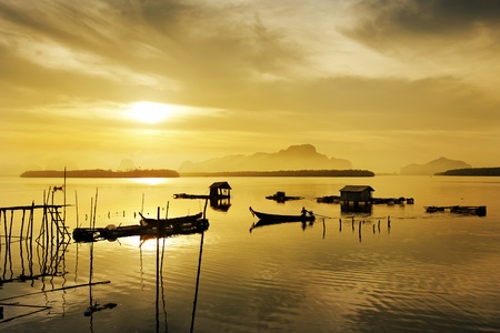 fisherman drive boat  in  river , Thailandの写真素材