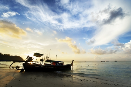 silhouette of island and beach in sunriseの写真素材