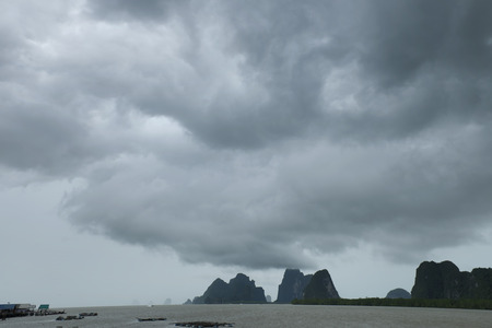 Dark storm clouds forming before the rainの写真素材