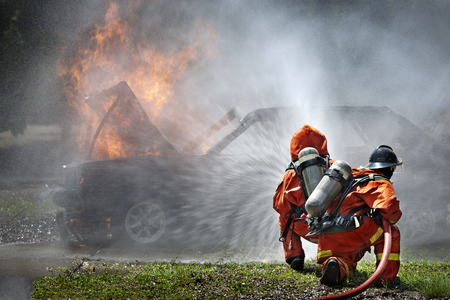Firefighters fighting fire during trainingの写真素材