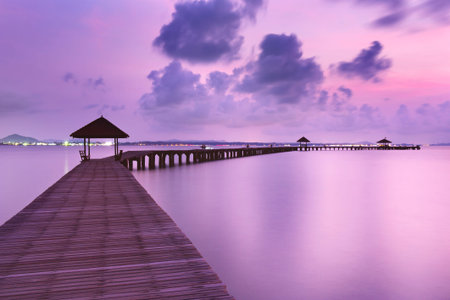 Old wood bridge to seaの写真素材