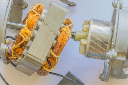 Soft focus the coil electric fan, copper wire, electric motor and stator parts, on white...