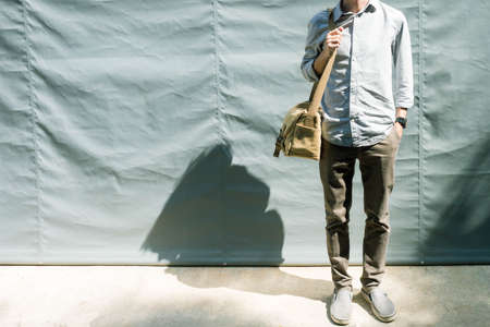 Man with shoulder canvas bagの写真素材