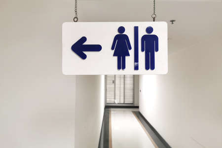 Man and woman toilet signboard in the buildingの写真素材