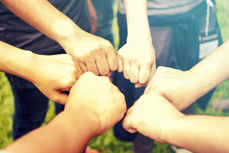 Close up of students or teenagers with hands fist outdoorsの写真素材