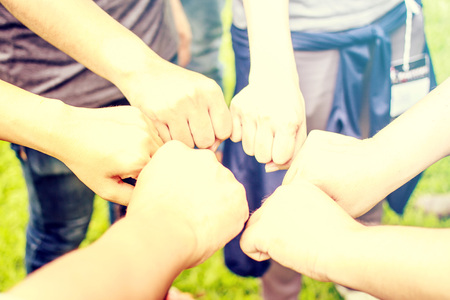 Close up of students or teenagers with hands fist outdoorsの写真素材