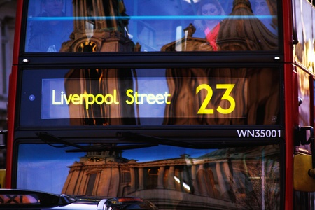 Red bus, with reflection of a buildingのeditorial素材