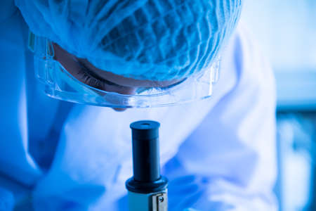 Young women Asian scientist is testing and experimenting with biology to find a vaccine to kill the virus.の写真素材