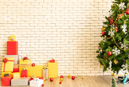 Christmas background with Christmas toys on the Xmas tree and giftの写真素材