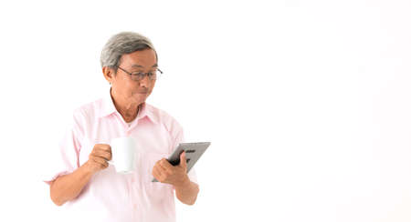 Older men and modern technology,isolatedの写真素材
