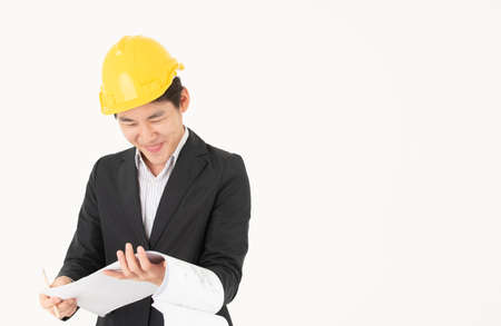 Asian male construction engineer follow up construction progressの写真素材