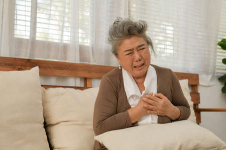 An elderly woman who has to look after himself without children and grandchildren to attention.の写真素材