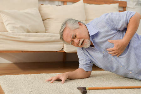 An elderly man who has to look after himself without children and grandchildren to attention.の写真素材