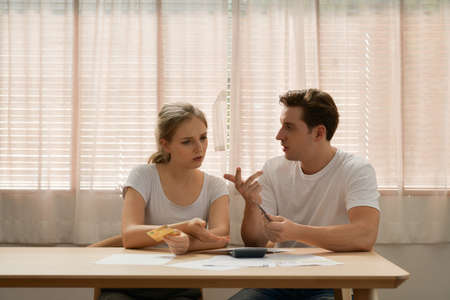 Couples with financial problems Being in a stressful mood and finding a solution for family financial problems, Need to talk about financial plans with financial advisors.の写真素材