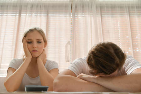 Couples with financial problems Being in a stressful mood and finding a solution for family financial problems, Need to talk about financial plans with financial advisors.の写真素材