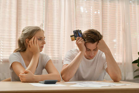 Couples with financial problems Being in a stressful mood and finding a solution for family financial problems, Need to talk about financial plans with financial advisors.の写真素材