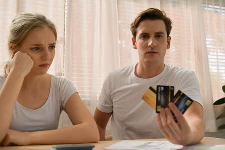 Couples with financial problems Being in a stressful mood and finding a solution for family financial problems, Need to talk about financial plans with financial advisors.の写真素材