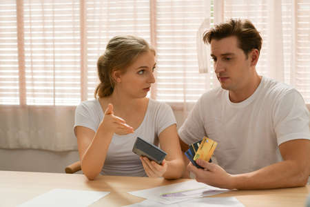 Couples with financial problems Being in a stressful mood and finding a solution for family financial problems, Need to talk about financial plans with financial advisors.の写真素材