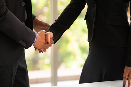 Successful business agreement of young businessmen and woman