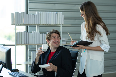 Businessmen, men, women analyze data and consult various issues In the office that has a natural...