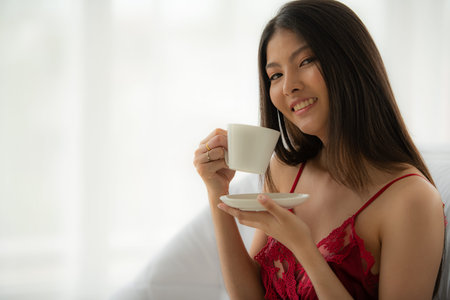 Beautiful sexy lady in elegant bikini and bra. Fashion portrait of model indoors. Beauty women with attractive bodies in underwear and pajamas.の写真素材