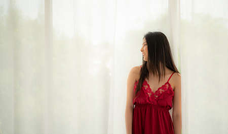 Beautiful sexy lady in elegant bikini and bra. Fashion portrait of model indoors. Beauty women with attractive bodies in underwear and pajamas.の写真素材