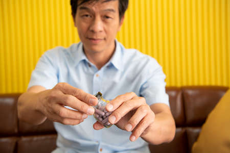 Senior businessmen and health that has to face as they age and to be who rely on medicines or assistive devices.の写真素材