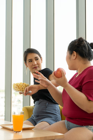Images of young women, trainers and students in weight loss classes and diet control classes for...