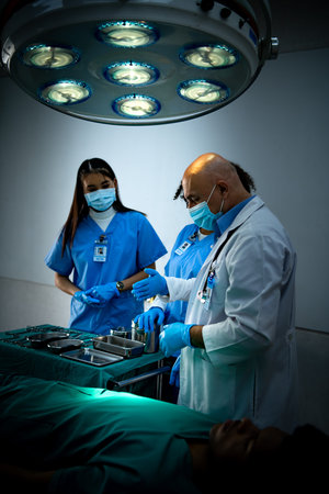 A medical professor is teaching surgery to medical students working at an international medical...