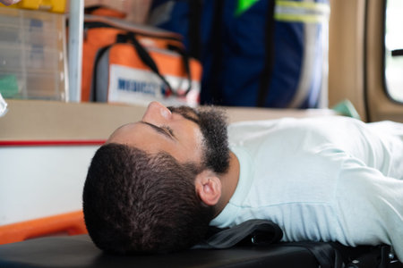 First aid assistance of the ambulance medical team with CPR method and hand-squeezed breathing...