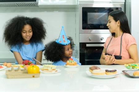 Asian-African American family Have a happy meal together in the dining room of the house.