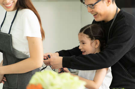 Asian family They are having breakfast together happily in the dining room of the house.の写真素材