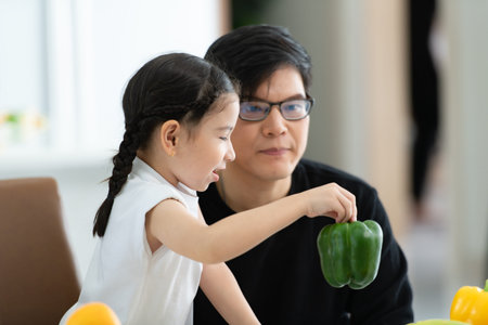 Asian family They are having breakfast together happily in the dining room of the house.の写真素材