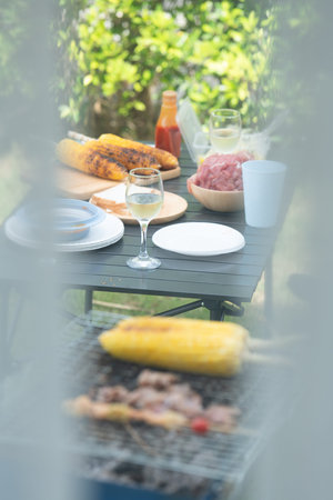 Chef cooking by grilling to wait for camping activity