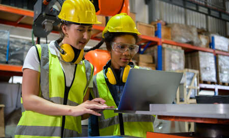 Woman engineer checking the operation of a welding robot. used for precision welding control Fast and highly secureの写真素材