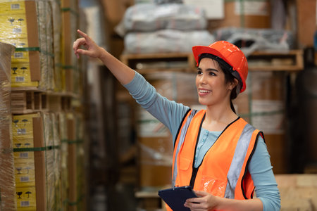 Portrait of an Asian female engineer with the personality of working in the warehouse