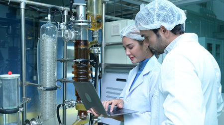 Scientists and assistants are in the machine room extracting oil and cannabis seeds. Inspecting...