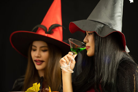 Asian young people attend a Halloween party which is dressed like zombies, devils, witches and...
