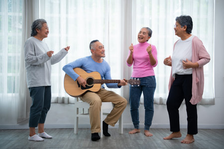 Old people's companions To unwind during the weekend, gather together for activities like singing, playing the guitar, and chit-chatting.の写真素材
