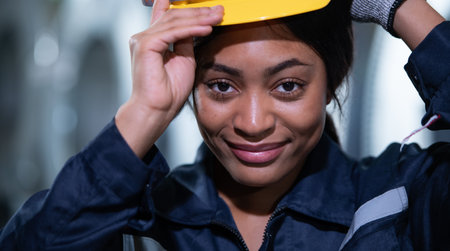 Portrait of a heavy equipment female engineer from a huge industry who came to inspect the factory's machinery.の写真素材