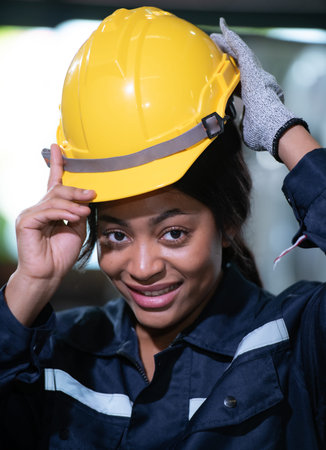 Portrait of a heavy equipment female engineer from a huge industry who came to inspect the factory's...