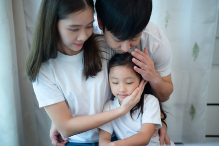 Family vacation, father and mother helping daughter practice in her piano lessons joyfully and...